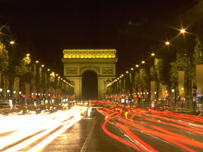 Traffic At Night In The Champs Elysee, Paris, France by David R. Frazier Pricing Limited Edition Print image