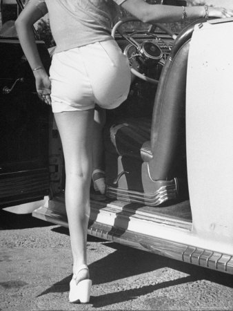 Betty Grable's Famous Legs As She Models White Shorts While Getting Into Driver's Seat Of Car by Walter Sanders Pricing Limited Edition Print image