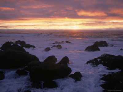 Waves Crashing Against Rocks At Sunset by Jeffry Myers Pricing Limited Edition Print image