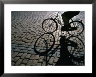 Shade Of Cyclist Crossing Amalienborg Slotsplads, Copenhagen, Denmark by Martin Llado Pricing Limited Edition Print image