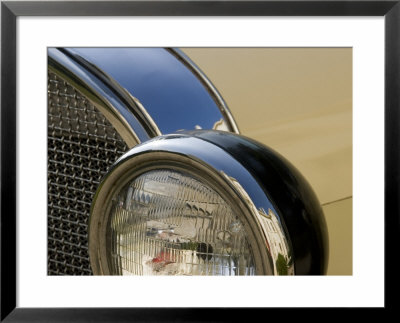Close View Of The Headlight And Grill Of A Vintage Car by Todd Gipstein Pricing Limited Edition Print image