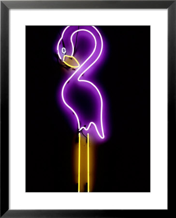 A Classic Florida Flamingo Glows On The Wall Of The Magic Beach Motel by Stephen St. John Pricing Limited Edition Print image
