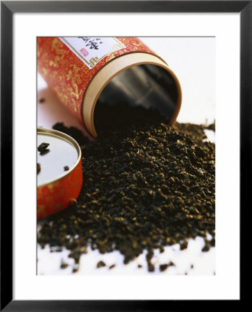 Tea Leaves Tipped Out In Front Of Tea Box by Joerg Lehmann Pricing Limited Edition Print image