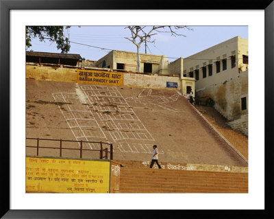 A Man Walks Past 9/11/01 Terrorism Graffiti On A Ganges River Bank by Jason Edwards Pricing Limited Edition Print image