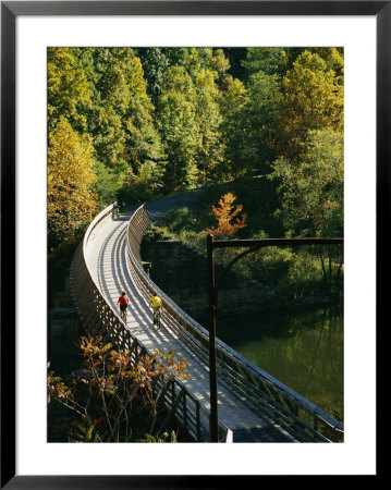Cyclists Cross A Bridge On The Greenbrier Trail In West Virginia by Skip Brown Pricing Limited Edition Print image