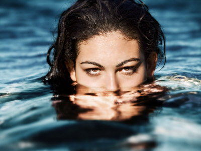 Young Turkish Girl In The Blue Waters Of The Mediterranean Ocean In Olympos, Turkey by Scott Stulberg Pricing Limited Edition Print image