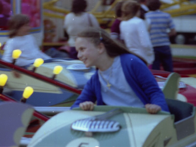 A Little Girl Has Lots Of Fun On A Fairground Ride At Godstone, Surrey by Vanessa Wagstaff Pricing Limited Edition Print image