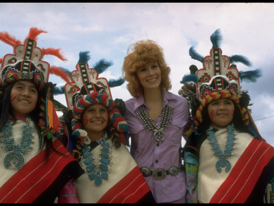 Jill St. John In Turquoise And Silver Squash Blossom Necklace, Surrounded By Costumed Navajo Women by Michael Mauney Pricing Limited Edition Print image