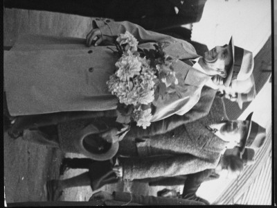 Nazi Propaganda Minister Joseph Goebbels Carrying Bouquet Of Flowers Upon Arrival At Airport by Alfred Eisenstaedt Pricing Limited Edition Print image