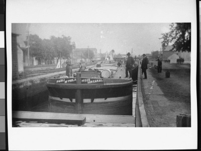 Mr. Smith And Mr. Whelan Standing Alongside A Mastless Barge By A Canal Dock by Wallace G. Levison Pricing Limited Edition Print image