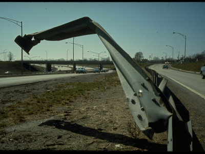 Guardrail Hanging In Air, A Danger To Drivers On Interstate Highway 71 by Ralph Crane Pricing Limited Edition Print image