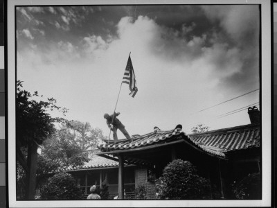 Marine Luther Leguire Raising American Flag On The Roof Of The Us Consulate by Sgt. John Babyak Jr. Pricing Limited Edition Print image