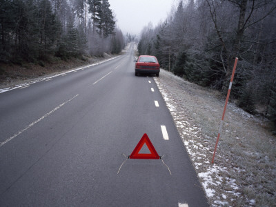 A Car Pulled To A Halt On A Roadside, A Warning Triangle Behind It by Bengt-Goran Carlsson Pricing Limited Edition Print image