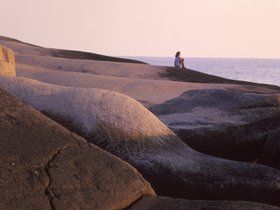Woman Sitting On Rock by Jorgen Larsson Pricing Limited Edition Print image