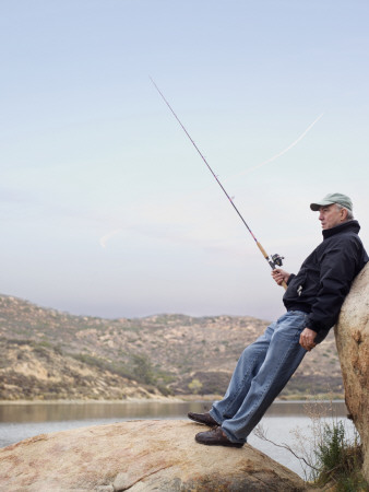 Man Fishing From Rock by Jp Greenwood Pricing Limited Edition Print image