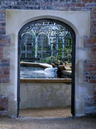 Water Feature: Archway Through To Stew Pond And Herb Garden, The Abbey House, Wiltshire by Clive Nichols Pricing Limited Edition Print image