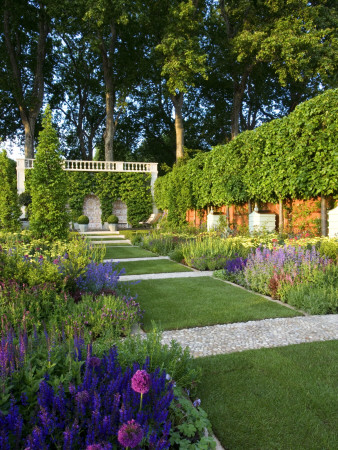 Pleached Hedge Of Lime Trees, Oak, Wicker Fence; Paths And Pebble Mosaics Across Lawn To Beehives by Clive Nichols Pricing Limited Edition Print image