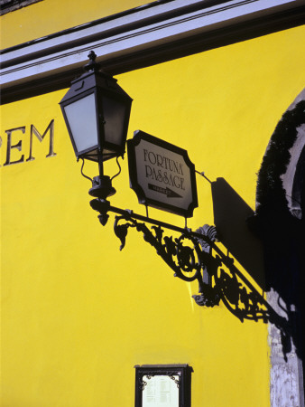 Streetlight On Yellow Wall, Buda, Budapest by Marcel Malherbe Pricing Limited Edition Print image