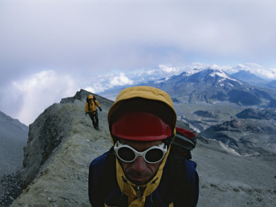 Expedition Members Traverse A Ridge On Bezymianny Crater, Kamchatka by Carsten Peter Pricing Limited Edition Print image