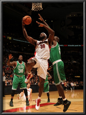 Boston Celtics V Toronto Raptors: Reggie Evans And Kevin Garnett by Ron Turenne Pricing Limited Edition Print image