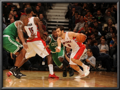 Boston Celtics V Toronto Raptors: Jose Calderon, Amir Johnson And Nate Robinson by Ron Turenne Pricing Limited Edition Print image