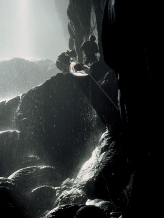 Moving A Kayak Through A Cave, Mexico by Michael Brown Pricing Limited Edition Print image