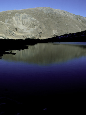 Mountain Reflected In A Blue Lake, Colorado by Michael Brown Pricing Limited Edition Print image