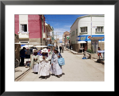 Women Walking Down Street, Copacabana, Laketiticaca, Bolivia, South America by Marco Simoni Pricing Limited Edition Print image