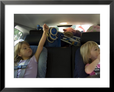 Kids Play During A Long Car Ride, Pittsburgh, Pennsylvania by Stacy Gold Pricing Limited Edition Print image