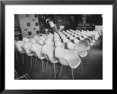Chairs Designed By Charles Eames Made Of Molded Plastic And Plywood by Peter Stackpole Pricing Limited Edition Print image