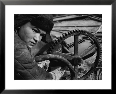 Russian Steel Worker Turning Gear Wheel In A Steel Mill by Margaret Bourke-White Pricing Limited Edition Print image