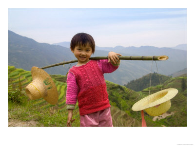 Young Girl Carrying Shoulder Pole With Straw Hats, China by Keren Su Pricing Limited Edition Print image