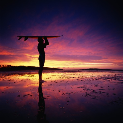 Surfer Standing On Beach At Sunset by Philip Lee Harvey Pricing Limited Edition Print image