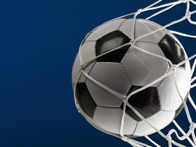 A Soccer Ball In A Net, Close-Up by Caspar Benson Pricing Limited Edition Print image