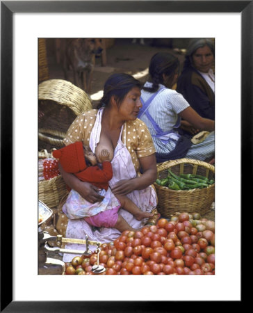 Fruit Vendor In Market Breast Feeding Her Daughter by John Dominis Pricing Limited Edition Print image