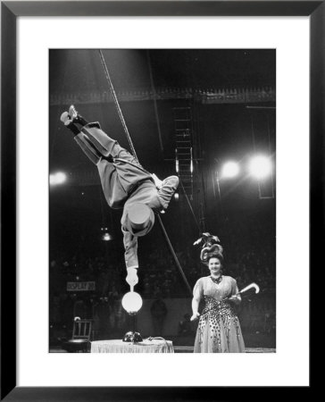 Circus Performer Balancer Unus Standing On His Index Finger On Globe Feet In Air Back Of Head by Ralph Morse Pricing Limited Edition Print image