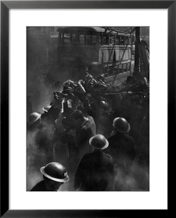 British Female Casualty Of German Robot Bombing Being Lifted On Stretcher By Rescue Squad by George Rodger Pricing Limited Edition Print image
