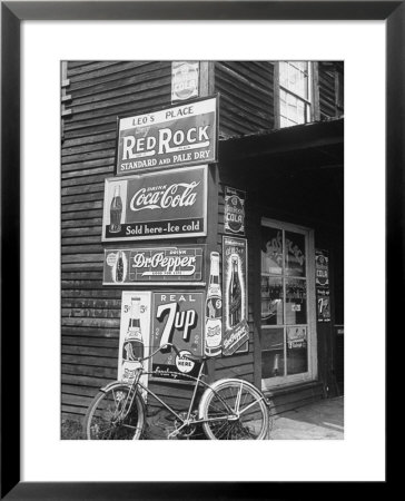 Food Store Called Leo's Place Covered With Beverage Ads Incl. Coca Cola, 7 Up, Dr. Pepper And Pepsi by Alfred Eisenstaedt Pricing Limited Edition Print image