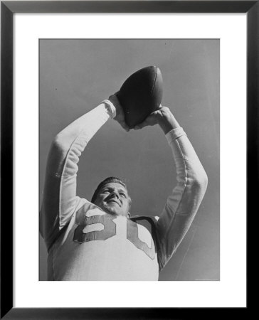 University Of Texas Football Player Malcolm Kutner Holding The Ball by George Strock Pricing Limited Edition Print image