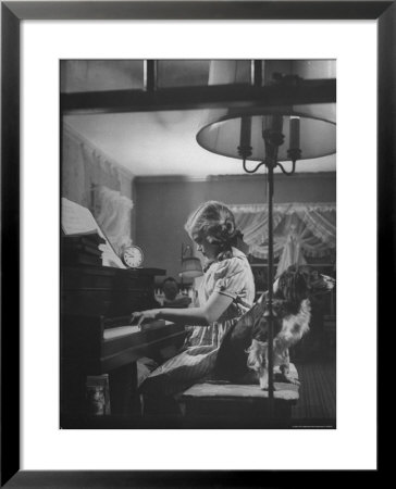 Suzy Creech, Typical Girl Known As A Pigtailer At Home Playing The Piano by Frank Scherschel Pricing Limited Edition Print image