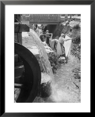 Washerwomen Washing The City's Clothes In The Stream by Walter Sanders Pricing Limited Edition Print image