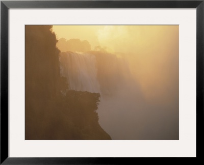 Mist Over Victoria Falls At Sunrise, Zimbabwe by Jim Zuckerman Pricing Limited Edition Print image