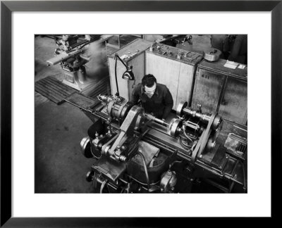 Worker Working At A Machine Inside The Innocenti Automobile Factory by A. Villani Pricing Limited Edition Print image
