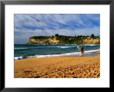 Surfer On Avalon Beach, Bilgola Headland In Background, Sydney, New South Wales, Australia by Ross Barnett Pricing Limited Edition Print image
