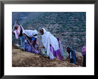 Women Repairing Road On Hillside, Eritrea by Oliver Strewe Pricing Limited Edition Print image