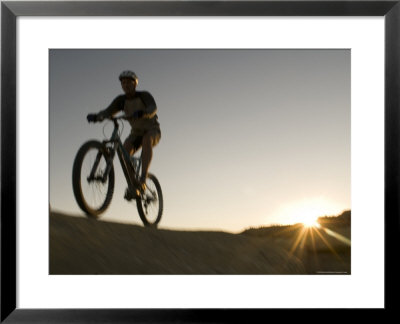 Man Mountain Bikes On Slickrock In Wyoming by Bobby Model Pricing Limited Edition Print image