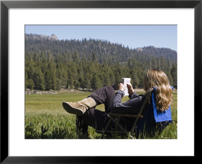 Woman Relaxing With A Book In Sequoia National Forest, California by Rich Reid Pricing Limited Edition Print image