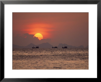 Silhouetted Fishing Boats On The Water At Sunset by Michael Melford Pricing Limited Edition Print image