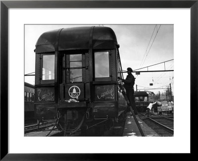 Workman Cleaning Car Of The Capitol Limited In Yard At Union Station by Alfred Eisenstaedt Pricing Limited Edition Print image