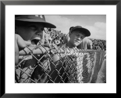 Young Fans Standing At Fence Which Borders Field At World Series Game, Braves Vs. Yankees by Grey Villet Pricing Limited Edition Print image